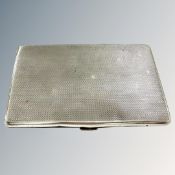 A silver cigarette case, Birmingham 1939, width 12.5cm.
