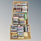 Three boxes containing approximately 150 DVD's