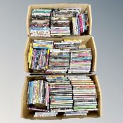 Three boxes containing approximately 150 DVD's