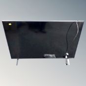 An LG 43 inch LCD TV with lead and remote