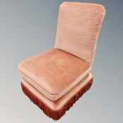 Two salon chairs in pink dralon upholstery