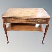 A walnut side table fitted a drawer with undershelf