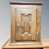 A 19th century painted single door wall cabinet