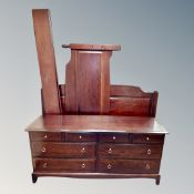 A Stag eight drawer bedroom chest together with matching bed frame