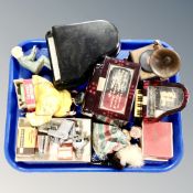 A tray of music boxes in the form of pianos, vintage lighter in the form of a gun,