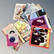 A box of vinyl LP records and singles : The Rolling Stones, The Animals, Buddy Holly,