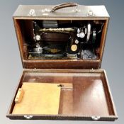 Two boxed vintage Singer sewing machines