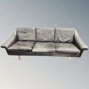 A late 20th century Scandinavian black leather three seater settee,