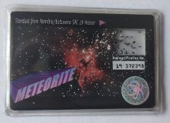 Stardust from Nambia/Botswana SRC 19 meteor encapsulated with authentication number.