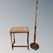 An Edwardian oak occasional table together with a standard lamp