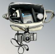 A camera bag contining Ricoh XR-X camera body and related accessories including Ricoh 35-70mm macro