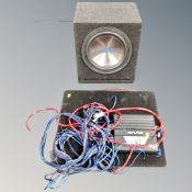 An Alpine sub woofer amp with cases and leads