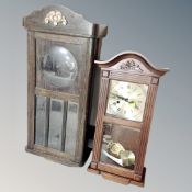 A Lincoln 31 day wall clock with pendulum and key,