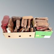 Two boxes of brown leather binocular cases.