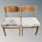 A mid century teak extending table and six chairs