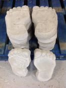 Twelve concrete garden feet stepping stones