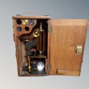 A lacquered brass microscope by W.