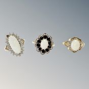 Three 9ct gold rings set with synthetic stones, opal, sapphire and zirconia, 8.7g gross.
