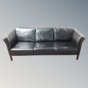A Scandinavian black leather three seater settee