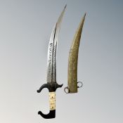 An Arabic knife with bone handle in brass sheath