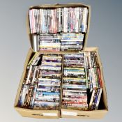Three boxes of approximately 150 DVDs,