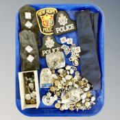 A group of police badges, buttons, insignia,