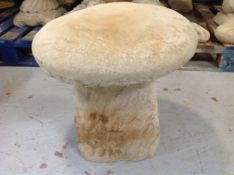 A concrete garden saddle stone,