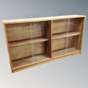 A set of mid 20th century teak sliding door bookshelves