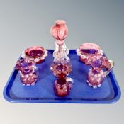 Seven pieces of antique cranberry glass.