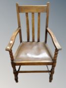 A pair of Edwardian oak carver armchairs