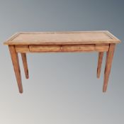 A contemporary console table fitted a drawer