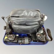 A Canon A-1 camera with 50mm lens, Canon Sure Shot Tele camera,