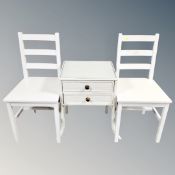 A two drawer bedside table on raised legs,