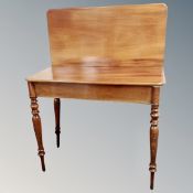 A 19th century turn over top tea table