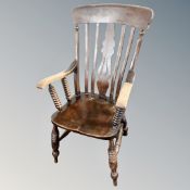 A Victorian elm and beech kitchen armchair