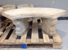 A concrete shaped garden bench on classical pedestals