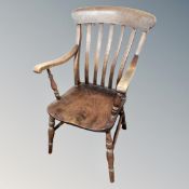 A Victorian elm and beech kitchen armchair
