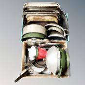 Two boxes of enamelled pans, cooking trays etc.