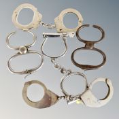 A group of steel handcuffs