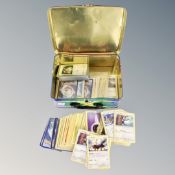A Pokemon lunch box containing a collection of Pokemon cards
