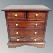 A Victorian style hardwood five drawer low chest