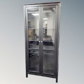 A stained ash double door bookcase,