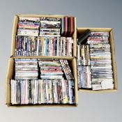 Three boxes containing approximately 150 DVD's