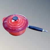 A Le Creuset cast iron lidded sauce pan