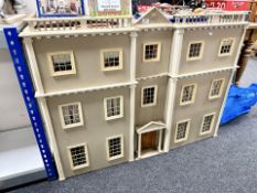 A Georgian style double fronted doll's house with accessories,