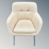 A 1960's armchair on metal legs