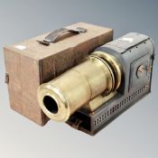 An antique Magic Lantern in tin case