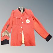 A British Army formal military tunic bearing Stg.