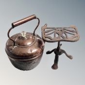 A Victorian copper kettle and a cast iron trivet
