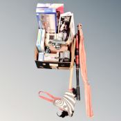 A box of jigsaws, board games, die cast vehicles, vintage hobby horse, fishing rods,